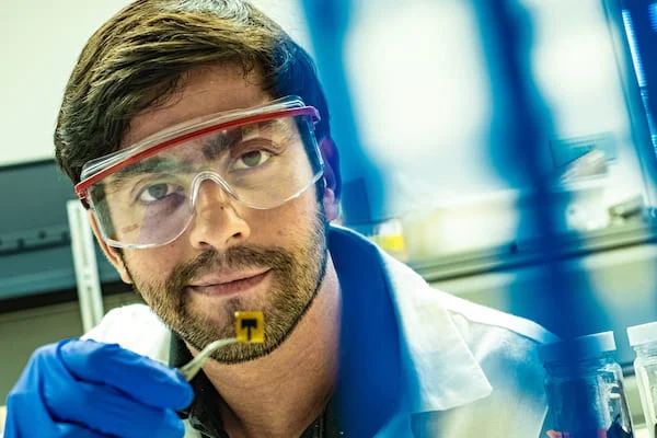 0610_ANTENNA-2-rn Rice University alumnus Amram Bengio holds a flexible nanotube film antenna. The antenna, which has proven as efficient as those made of copper wire, can essentially be painted onto devices. (Credit: Jeff Fitlow/Rice University)