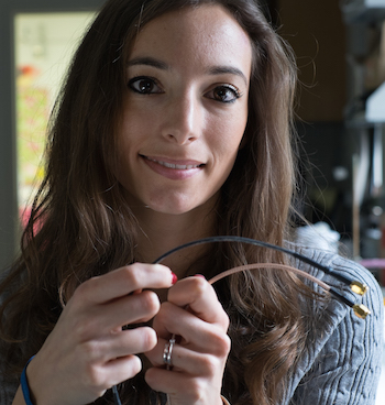 Rice University research scientist Francesca Mirri holds a standard coaxial data cable (bottom) and a new cable with an outer conductor of carbon nanotubes.