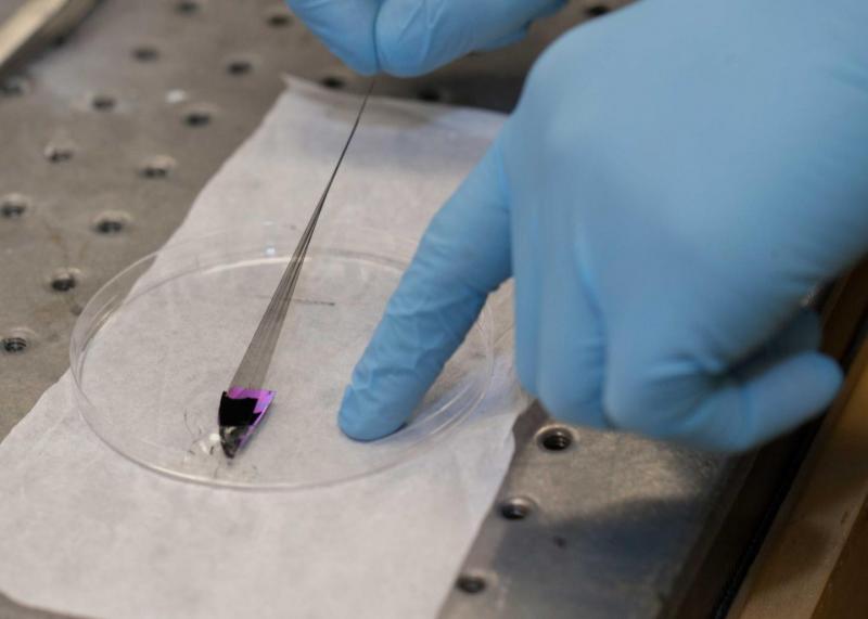 carbon nanotube fibers being pulled into strong, conductive thread