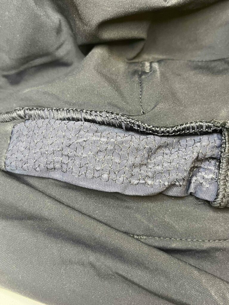 Stretchable grid pattern of Galvorn CNT yarn embroidered on the inside surface of a prototype wearable vest, as an electrode surface for ECG signals