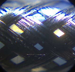 A close-up image of a Galvorn braid composed of untwisted bundles of carbon nanotube fiber